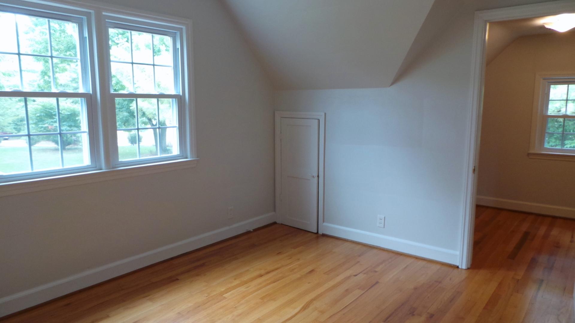 8659 Roanoke Road Elliston, VA 24087 - Photo 9 of 32 an empty room with wooden floor and windows