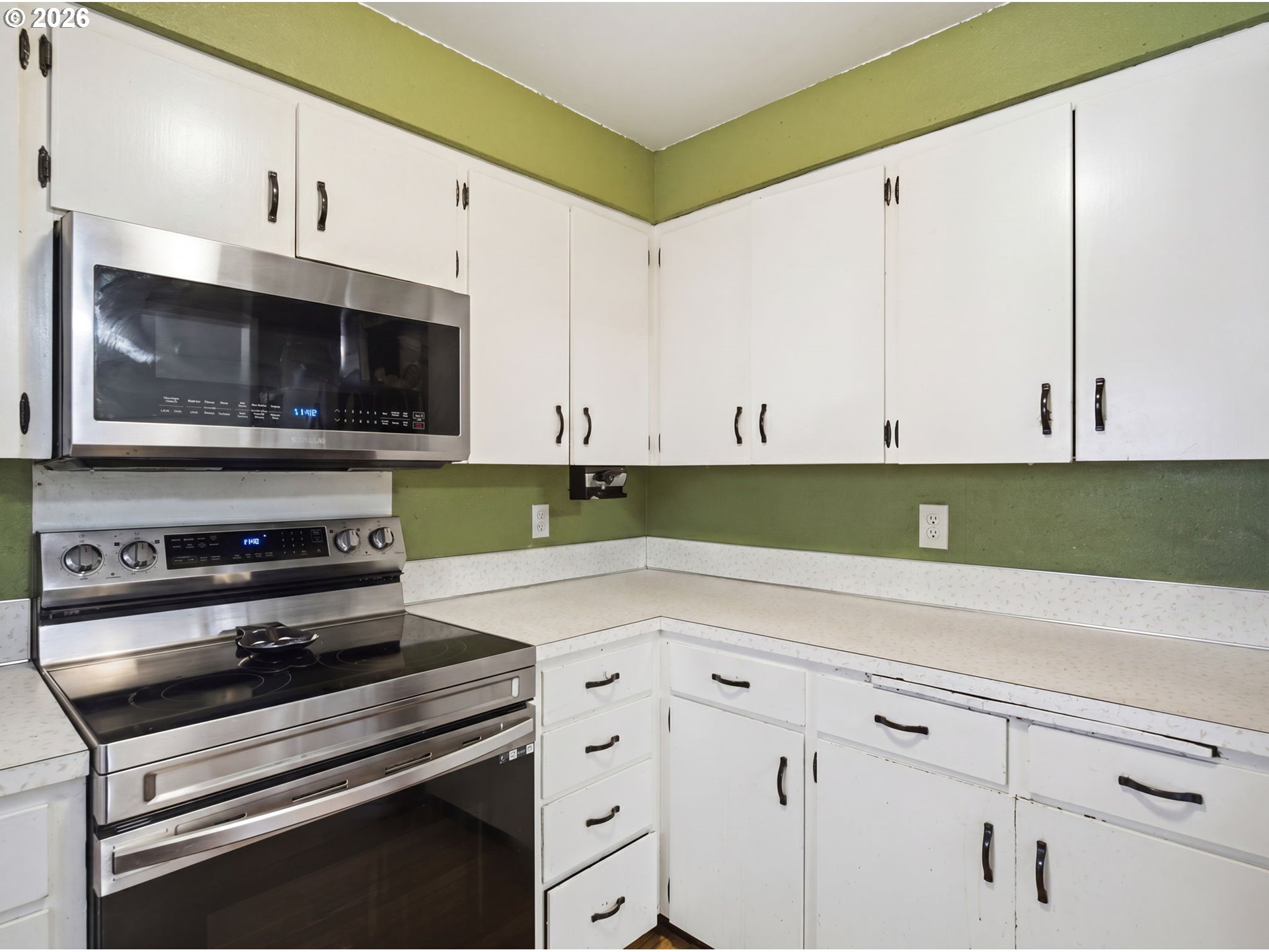 1357 Grove Street Lebanon, OR 97355 - Photo 9 of 37 a kitchen with appliances cabinets and a window