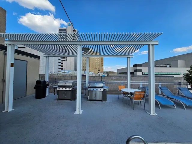 a view of a big room with dining room and furniture