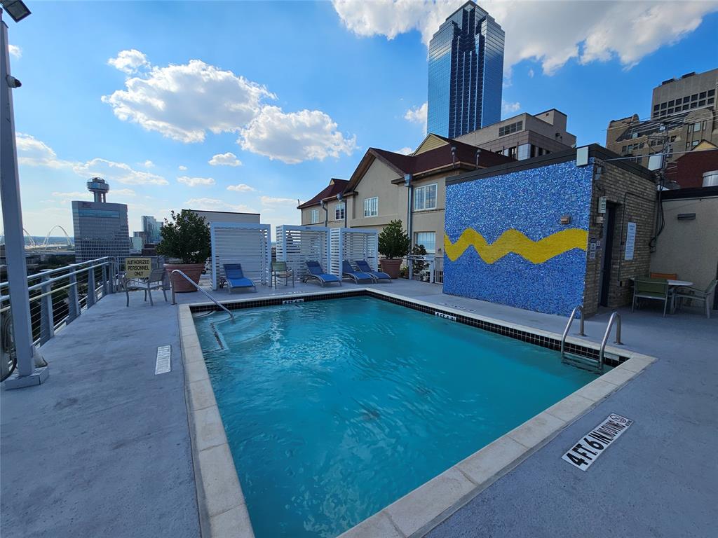 1122 Jackson Street, Unit 919 Dallas, TX 75202 - Photo 19 of 21 a swimming pool with outdoor seating and yard in back