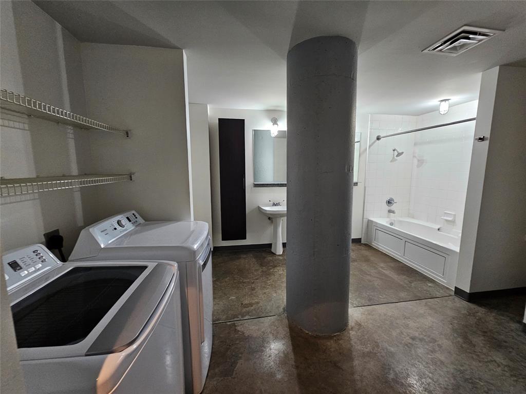 1122 Jackson Street, Unit 919 Dallas, TX 75202 - Photo 7 of 21 a utility room with dryer and washer