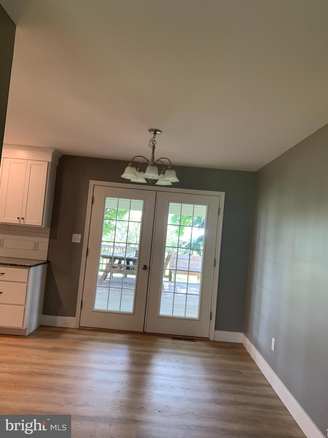 549 Hi View Drive Lititz, PA 17543 - Photo 7 of 42 a view of an empty room with wooden floor and a window