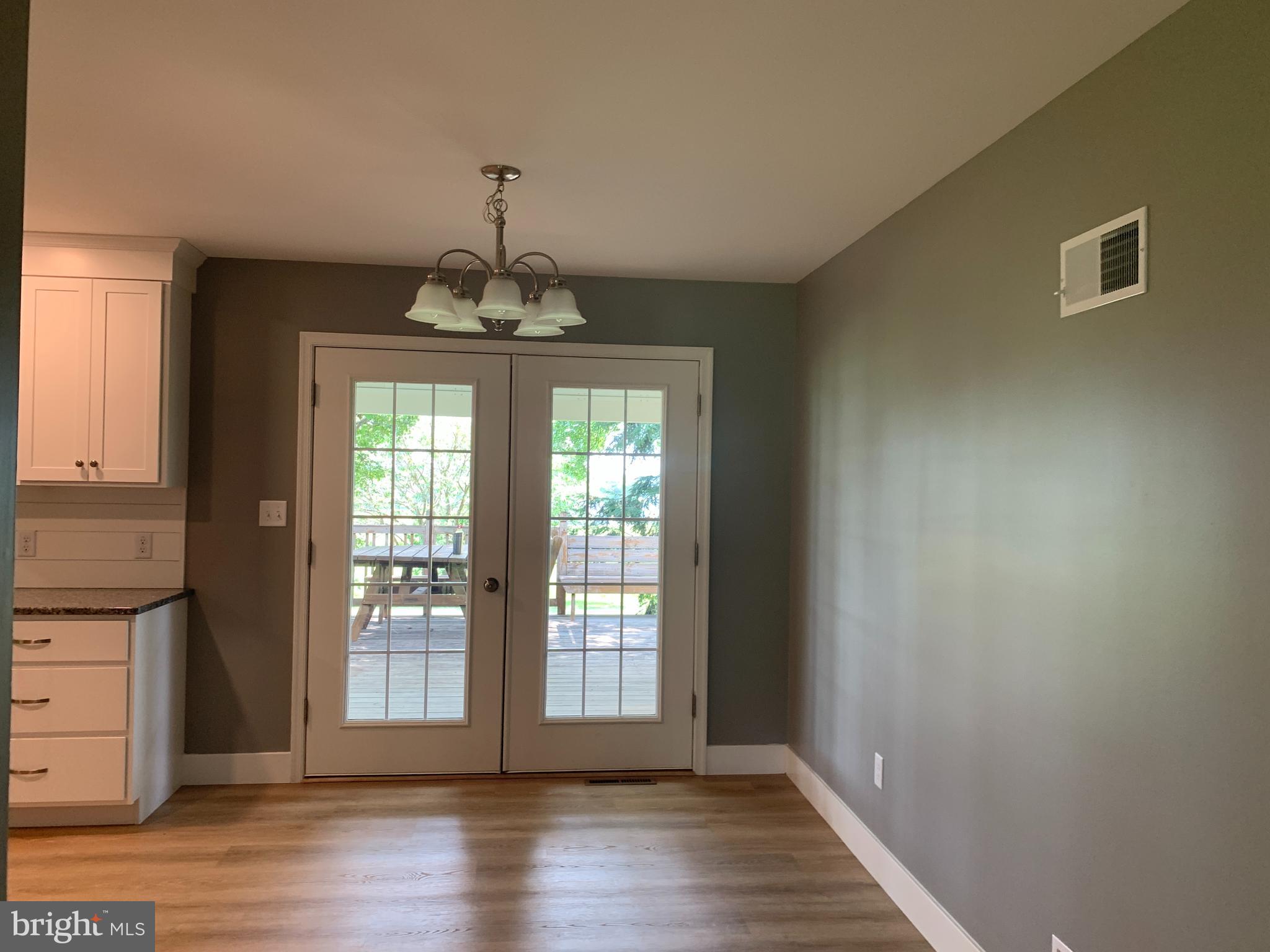 549 Hi View Drive Lititz, PA 17543 - Photo 8 of 42 a view of an empty room with wooden floor and a window