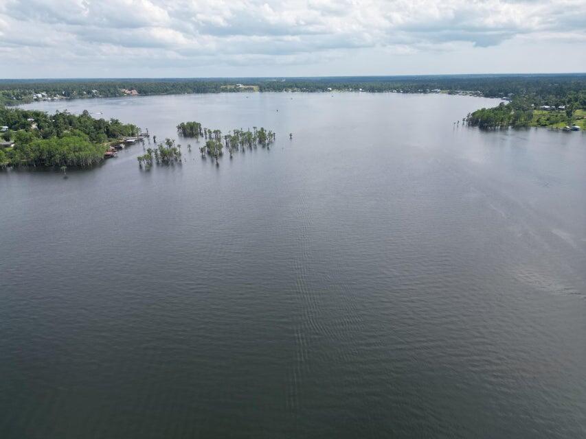 Lot 17 Dorcas Road Marianna, FL 32448 - Photo 17 of 18 a view of a lake with houses in back