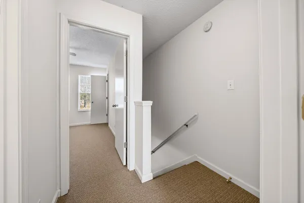 a view of a hallway with closet