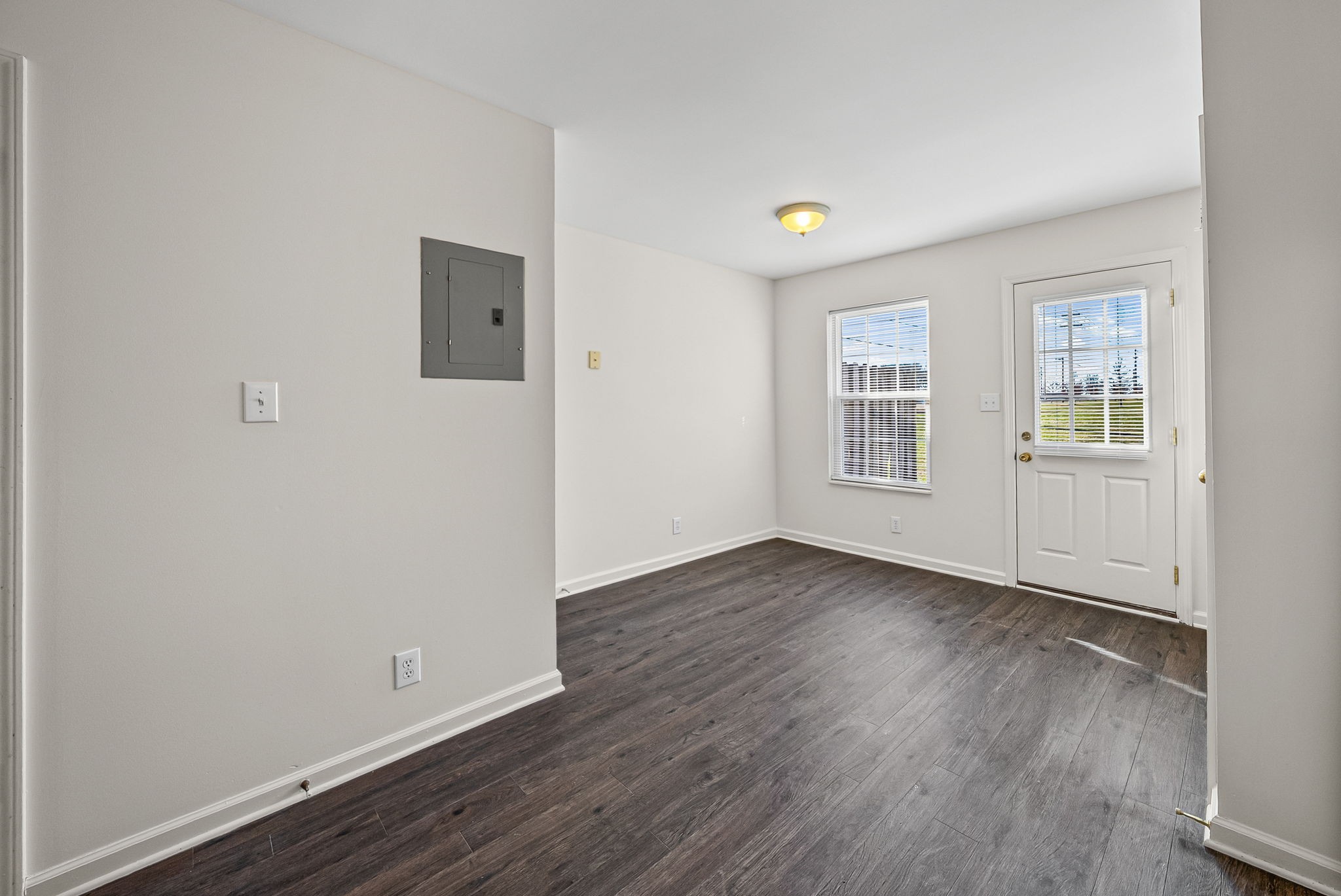 3300 Royster Lane, Unit C Clarksville, TN 37042 - Photo 8 of 18 an empty room with wooden floor and windows