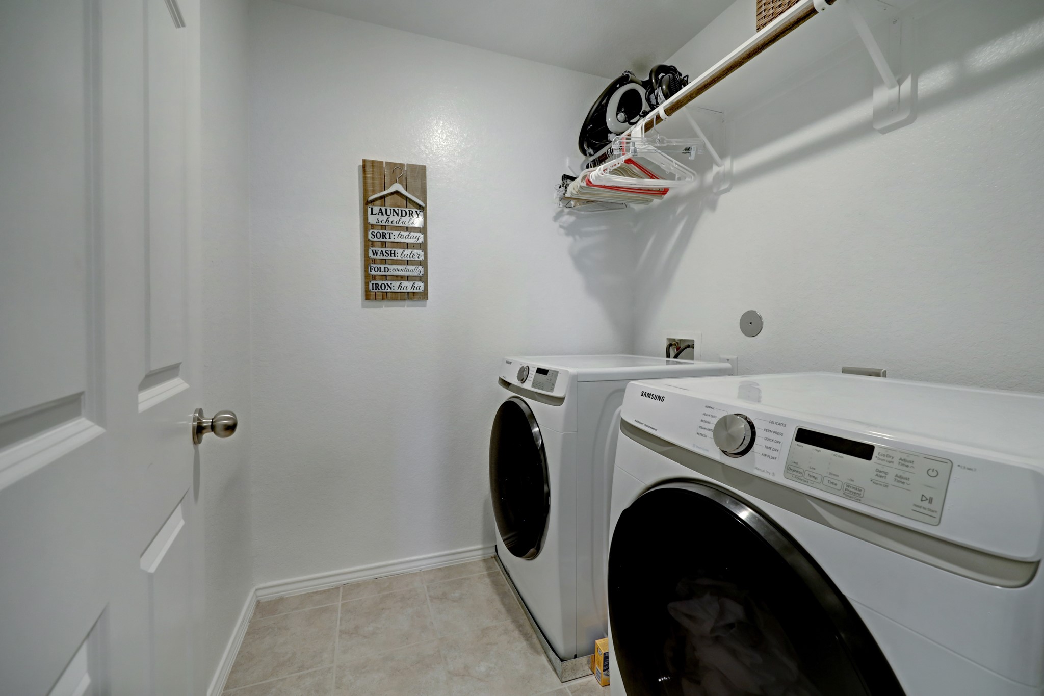 25735 Royal Catchfly Road Katy, TX 77493 - Photo 21 of 31 Utility room features enough space for full-size machines and a hanging rod.