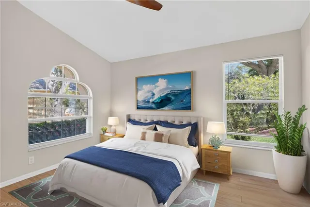 a bedroom with a large bed and a window