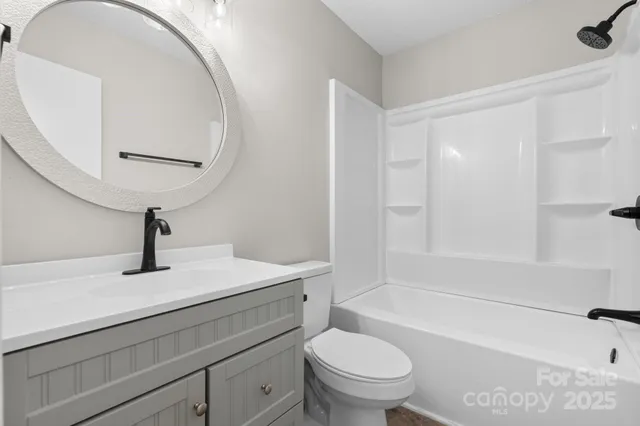 a bathroom with a sink a toilet and a bathtub