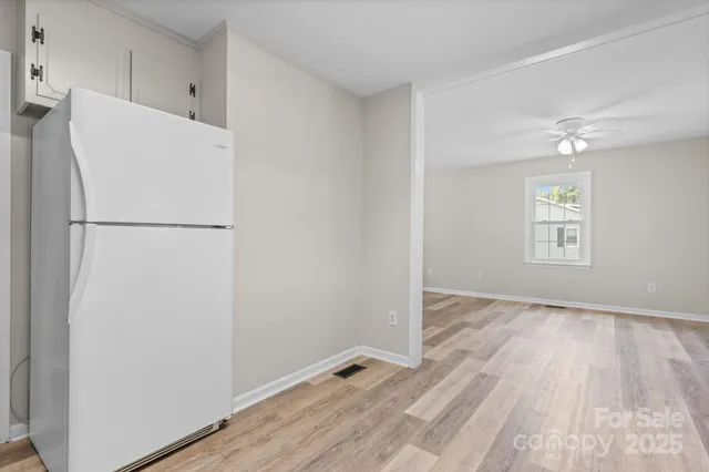 a white refrigerator freezer sitting in a kitchen