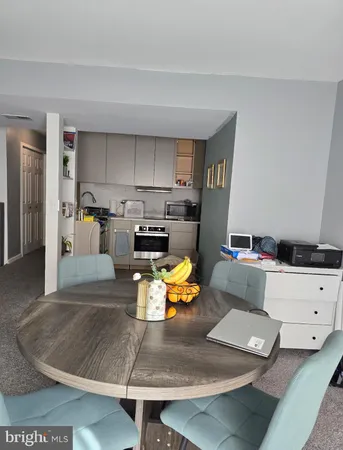 a kitchen with a sink and a stove top oven