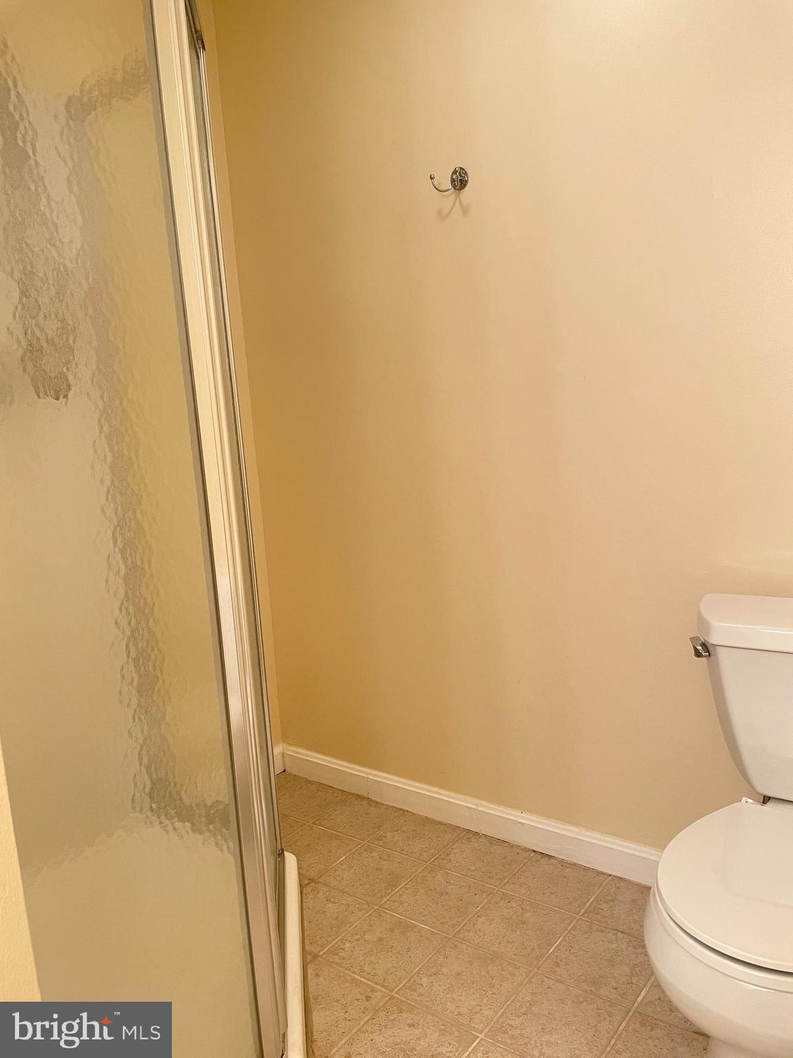 12405 Gooderham Way Gaithersburg, MD 20878 - Photo 27 of 31 a bathroom with a toilet and a shower