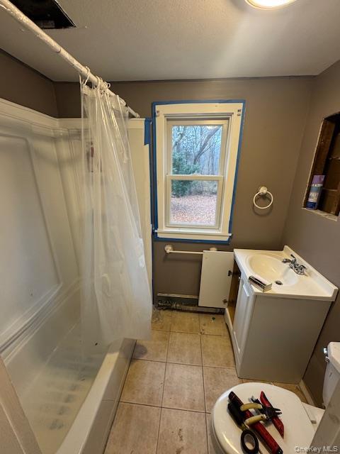 1134 Stony Brook Road Lake Grove, NY 11755 - Photo 12 of 18 a bathroom with a window and a shower