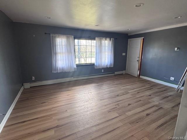 1134 Stony Brook Road Lake Grove, NY 11755 - Photo 5 of 18 wooden floor in an empty room with a window