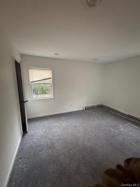 1134 Stony Brook Road Lake Grove, NY 11755 - Photo 7 of 18 an empty room with a window