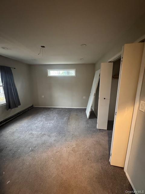 1134 Stony Brook Road Lake Grove, NY 11755 - Photo 8 of 18 an empty room with a window