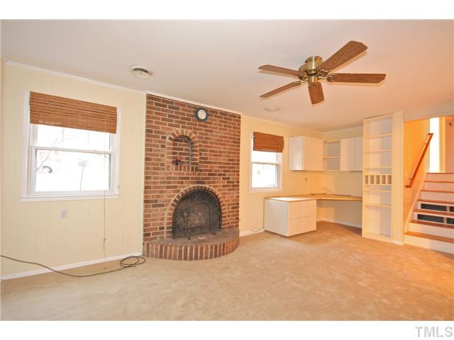 5412 Newhall Road Durham, NC 27713 - Photo 8 of 25 a living room with furniture and a fireplace
