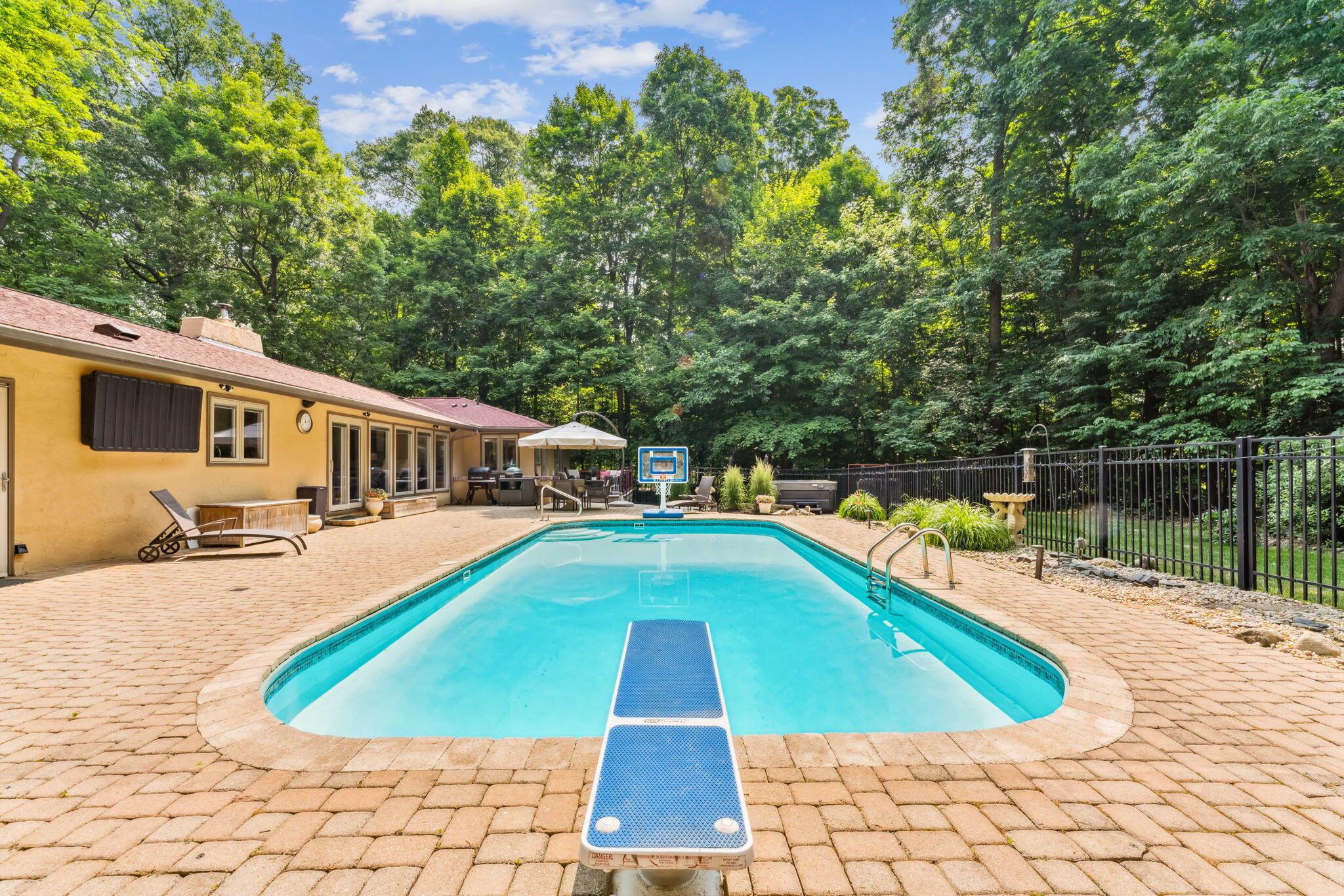 2423 Carriage Road Powell, OH 43065 - Photo 5 of 100 Enjoy outdoor entertaining with your private oasis showcasing an inground pool with diving board!