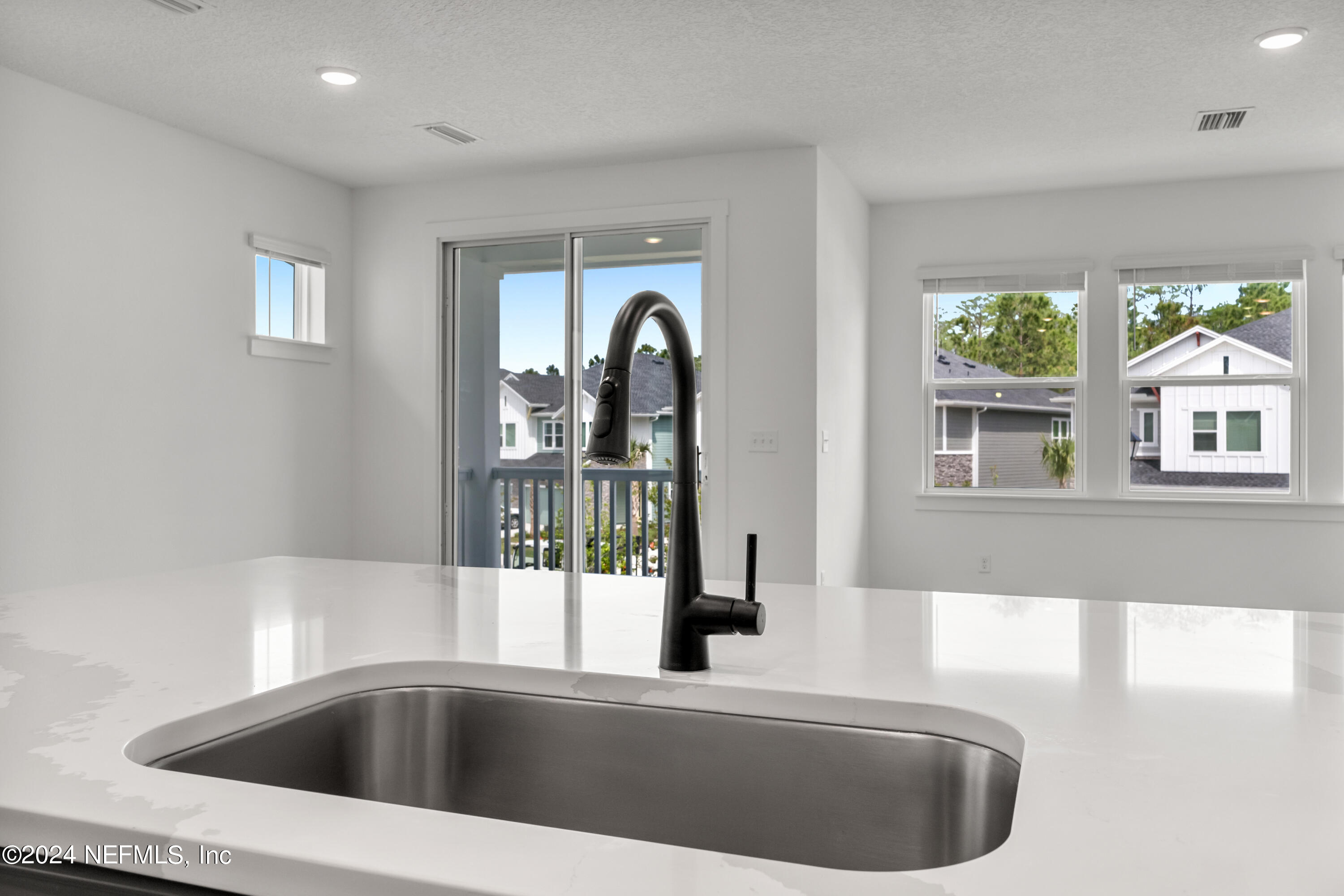 9830 Element Road Jacksonville, FL 32256 - Photo 8 of 18 a view of a bathroom with a tub sink and mirror
