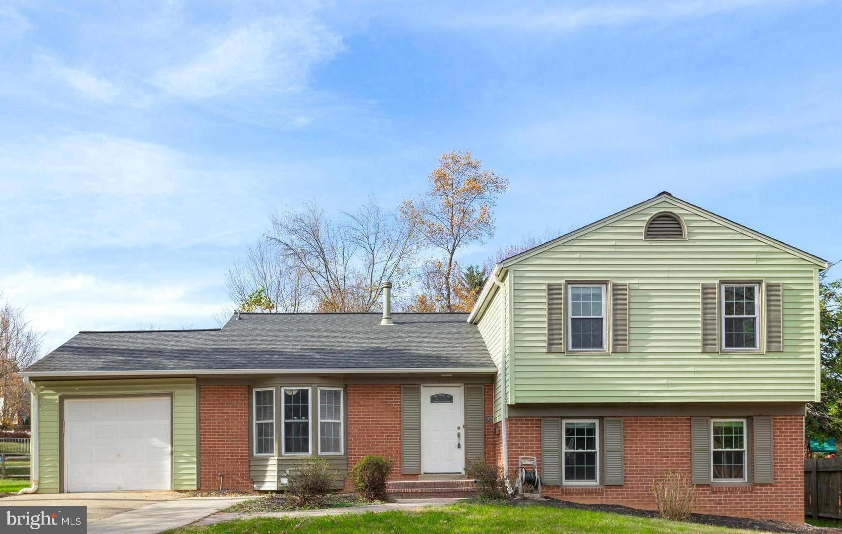 8403 Harker Drive Potomac, MD 20854 - Photo 1 of 33 a front view of a house with garden