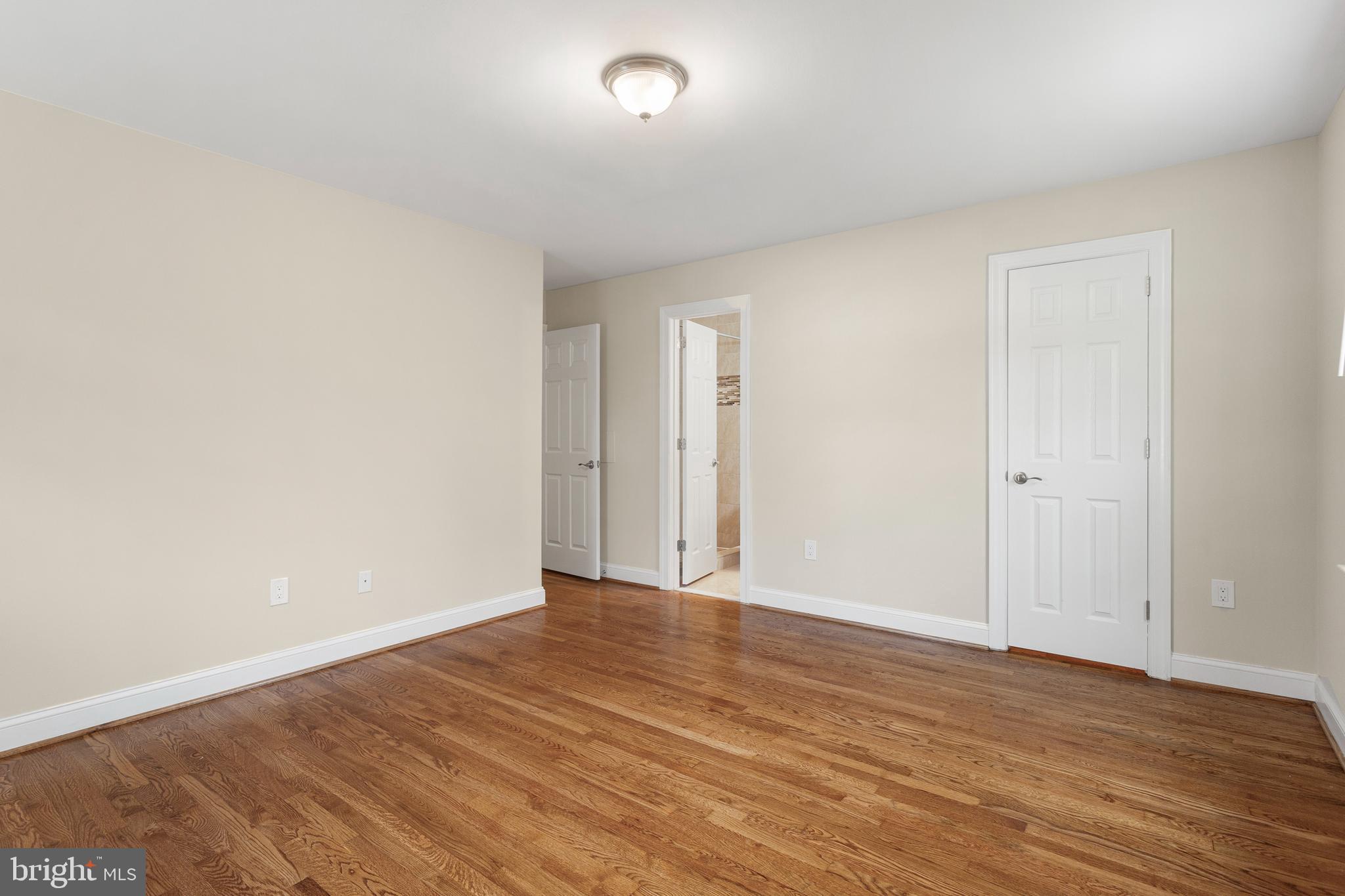 8403 Harker Drive Potomac, MD 20854 - Photo 12 of 33 a view of an empty room with wooden floor