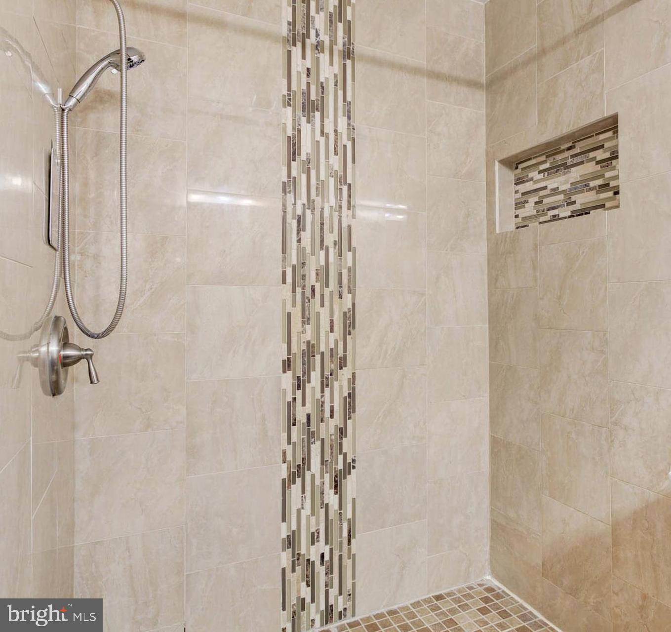 8403 Harker Drive Potomac, MD 20854 - Photo 15 of 33 a bathroom with a shower