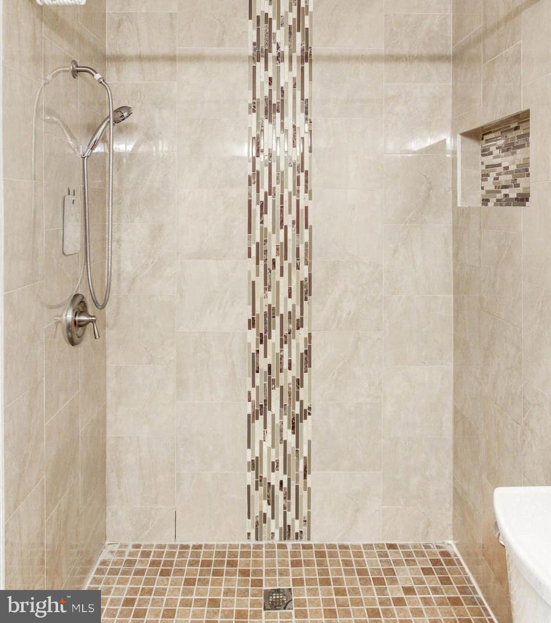 8403 Harker Drive Potomac, MD 20854 - Photo 16 of 33 a bathroom with a shower