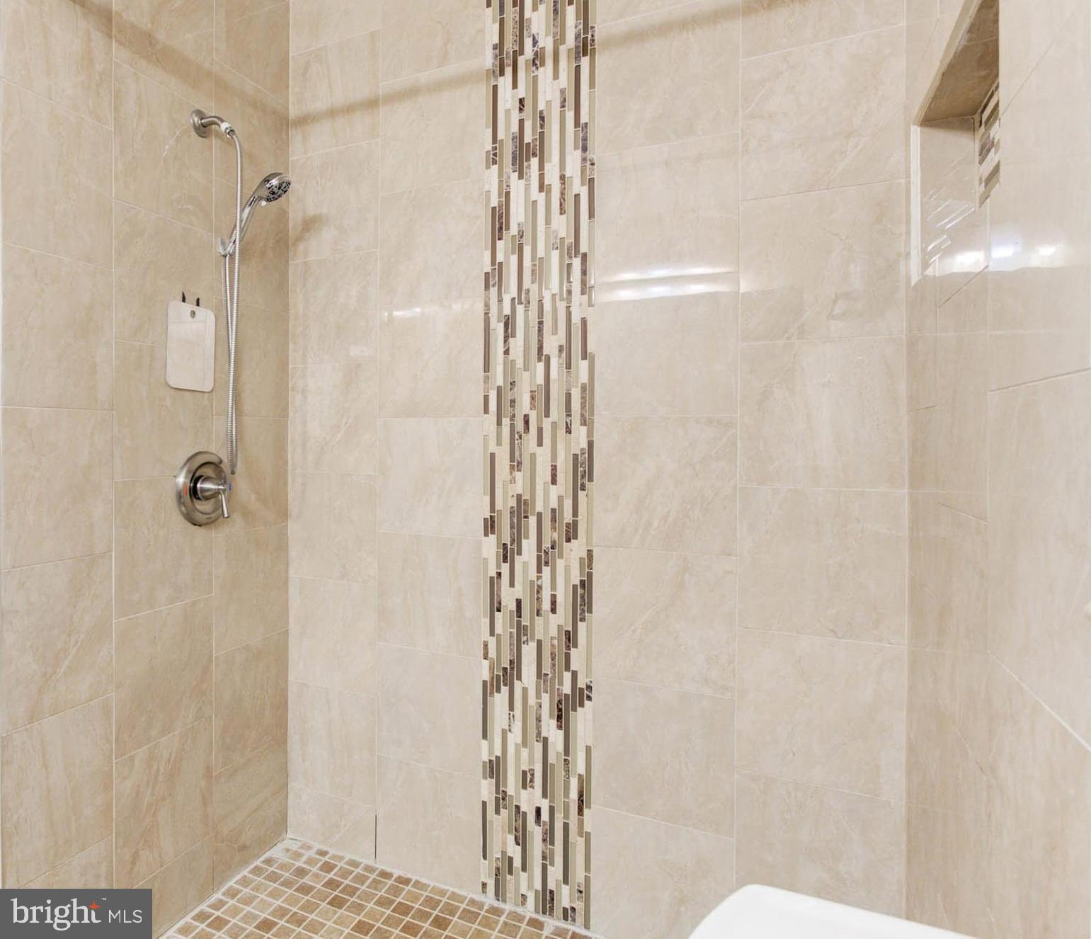 8403 Harker Drive Potomac, MD 20854 - Photo 17 of 33 a bathroom with a shower