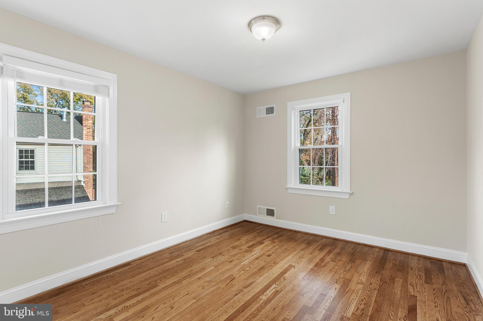 8403 Harker Drive Potomac, MD 20854 - Photo 19 of 33 a view of empty room with wooden floor and fan