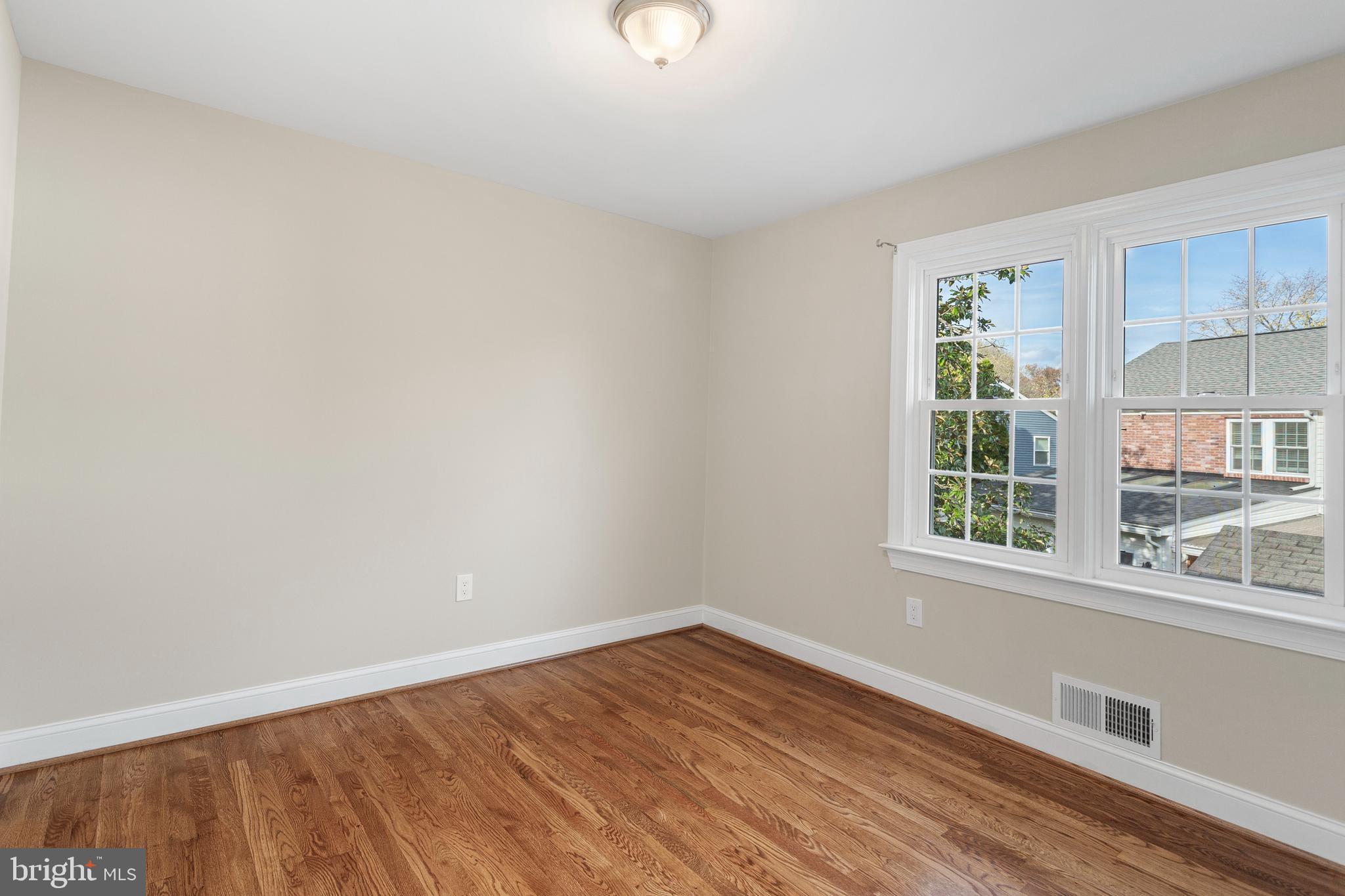 8403 Harker Drive Potomac, MD 20854 - Photo 20 of 33 a view of empty room with wooden floor and fan