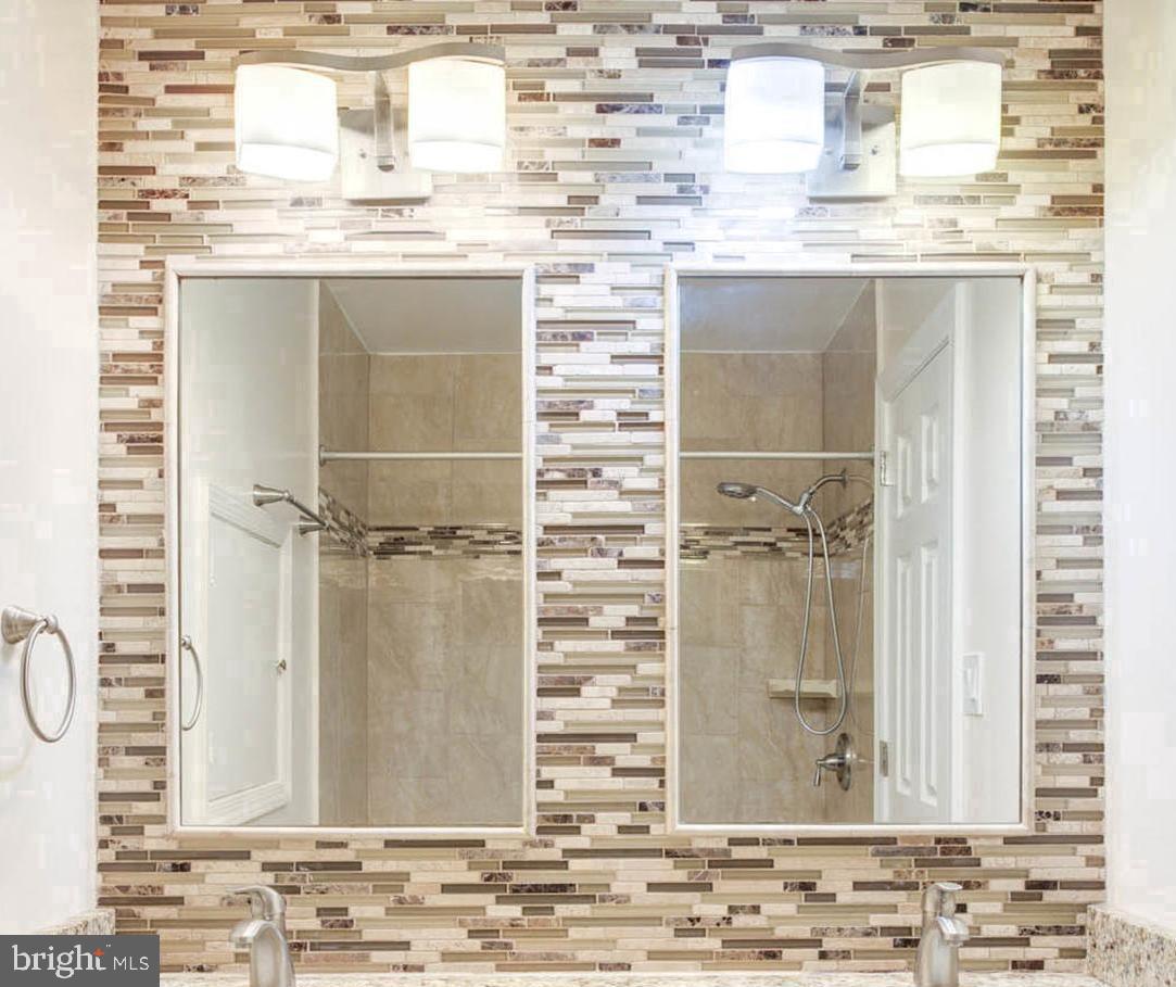 8403 Harker Drive Potomac, MD 20854 - Photo 21 of 33 a kitchen with a sink and cabinets