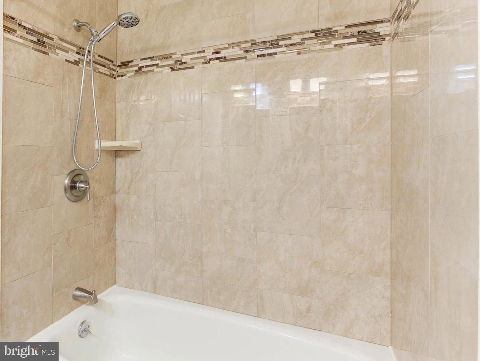 8403 Harker Drive Potomac, MD 20854 - Photo 23 of 33 a bathroom with a shower and a shower