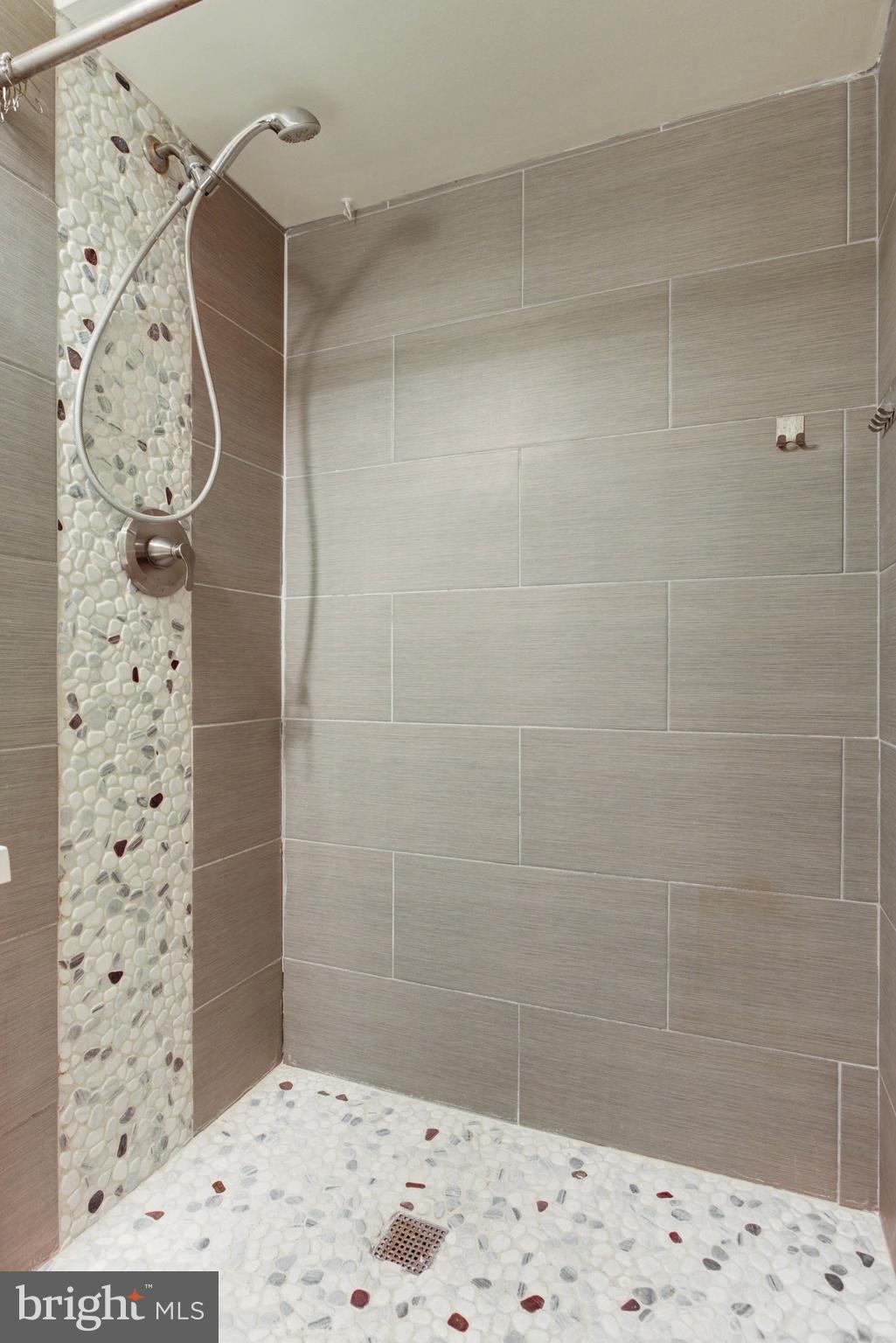 8403 Harker Drive Potomac, MD 20854 - Photo 30 of 33 a bathroom with a shower