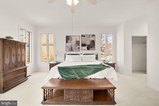 a view of a livingroom with furniture window and wooden floor