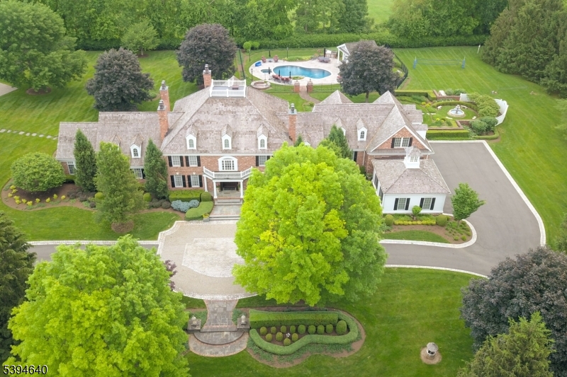 an aerial view of a house with garden space lake view and houses