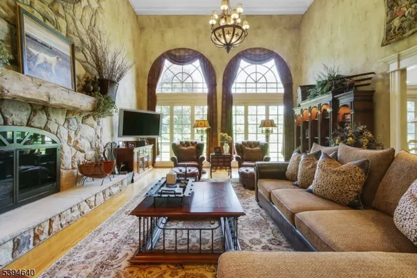 a living room with furniture and a rug