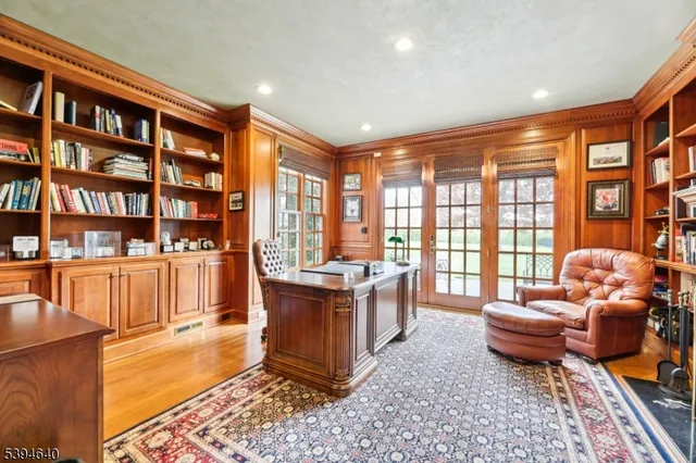 a bathroom with a tub shower vanity and toilet