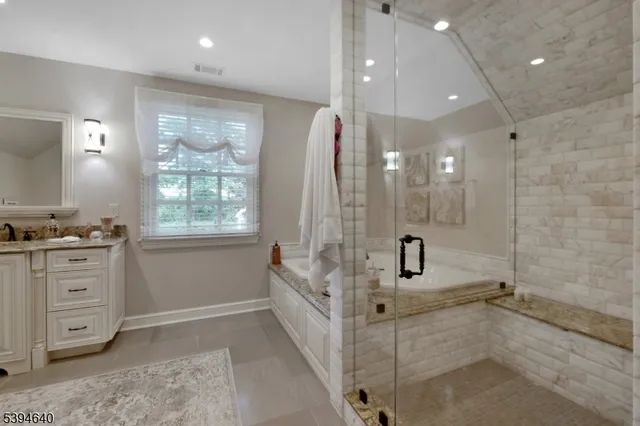 a living room with furniture a table and a chandelier