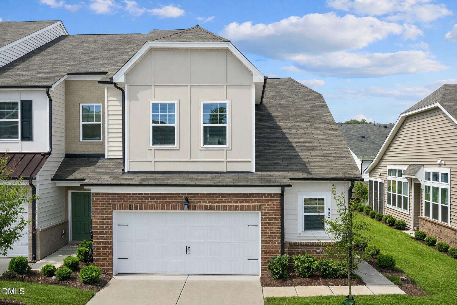 a view of a brick house with many windows