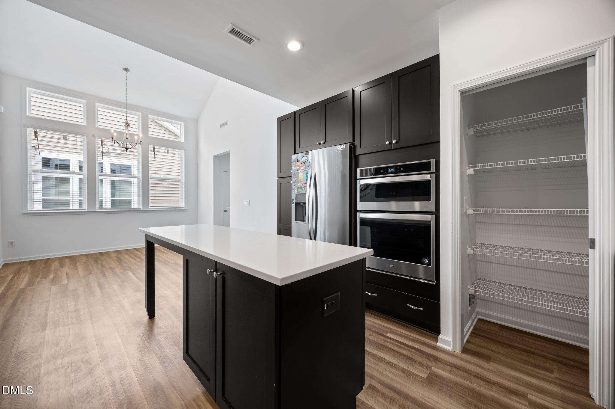 902 Talbot Place Durham, NC 27703 - Photo 13 of 49 a kitchen with kitchen island wooden cabinets and stainless steel appliances