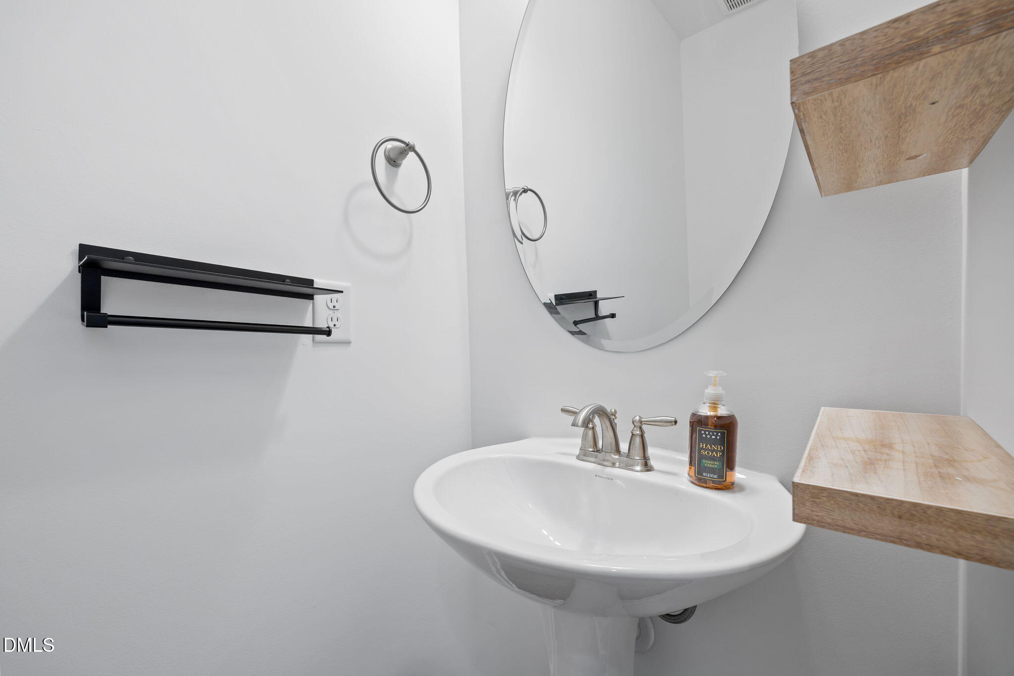 902 Talbot Place Durham, NC 27703 - Photo 14 of 49 a bathroom with a sink and a mirror