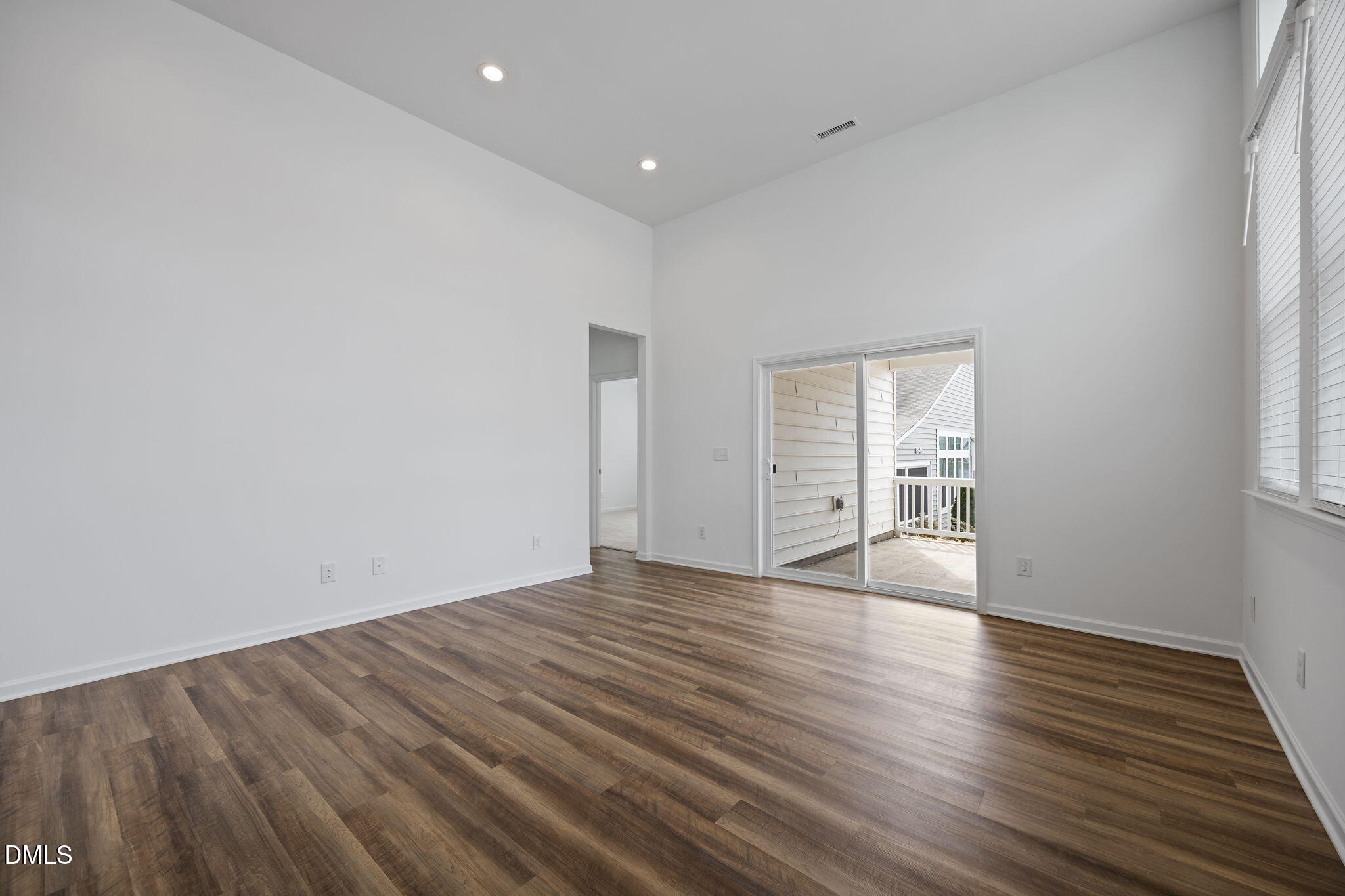 902 Talbot Place Durham, NC 27703 - Photo 21 of 49 a view of an empty room with wooden floor and a window