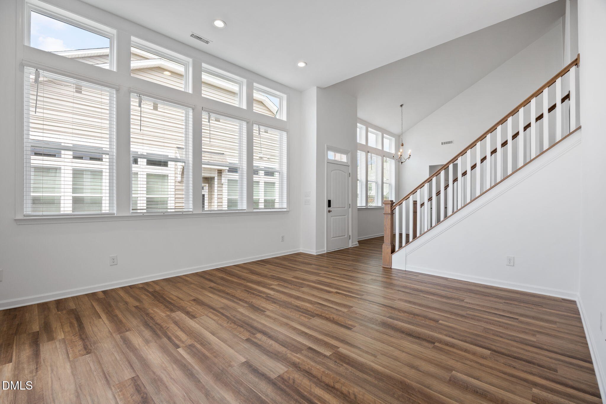 902 Talbot Place Durham, NC 27703 - Photo 23 of 49 a view of an empty room with wooden floor and a window
