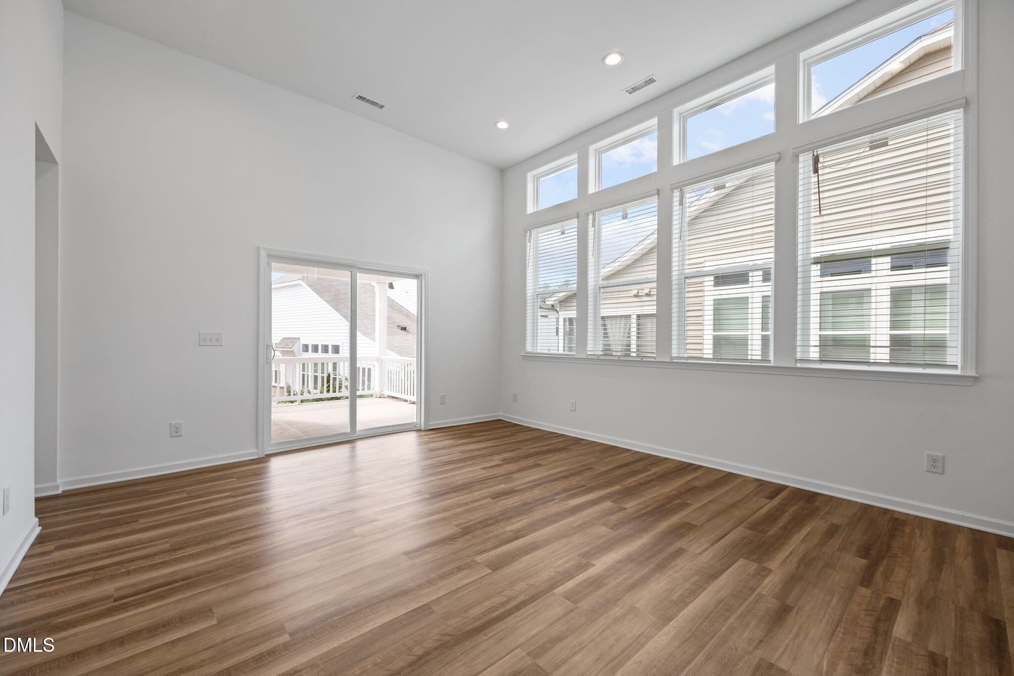 902 Talbot Place Durham, NC 27703 - Photo 24 of 49 a view of an empty room with wooden floor and a window