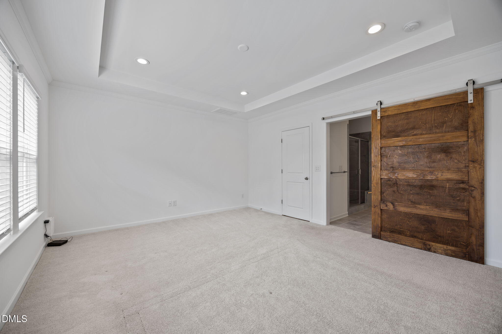 902 Talbot Place Durham, NC 27703 - Photo 27 of 49 an empty room with a cabinet and mirrors