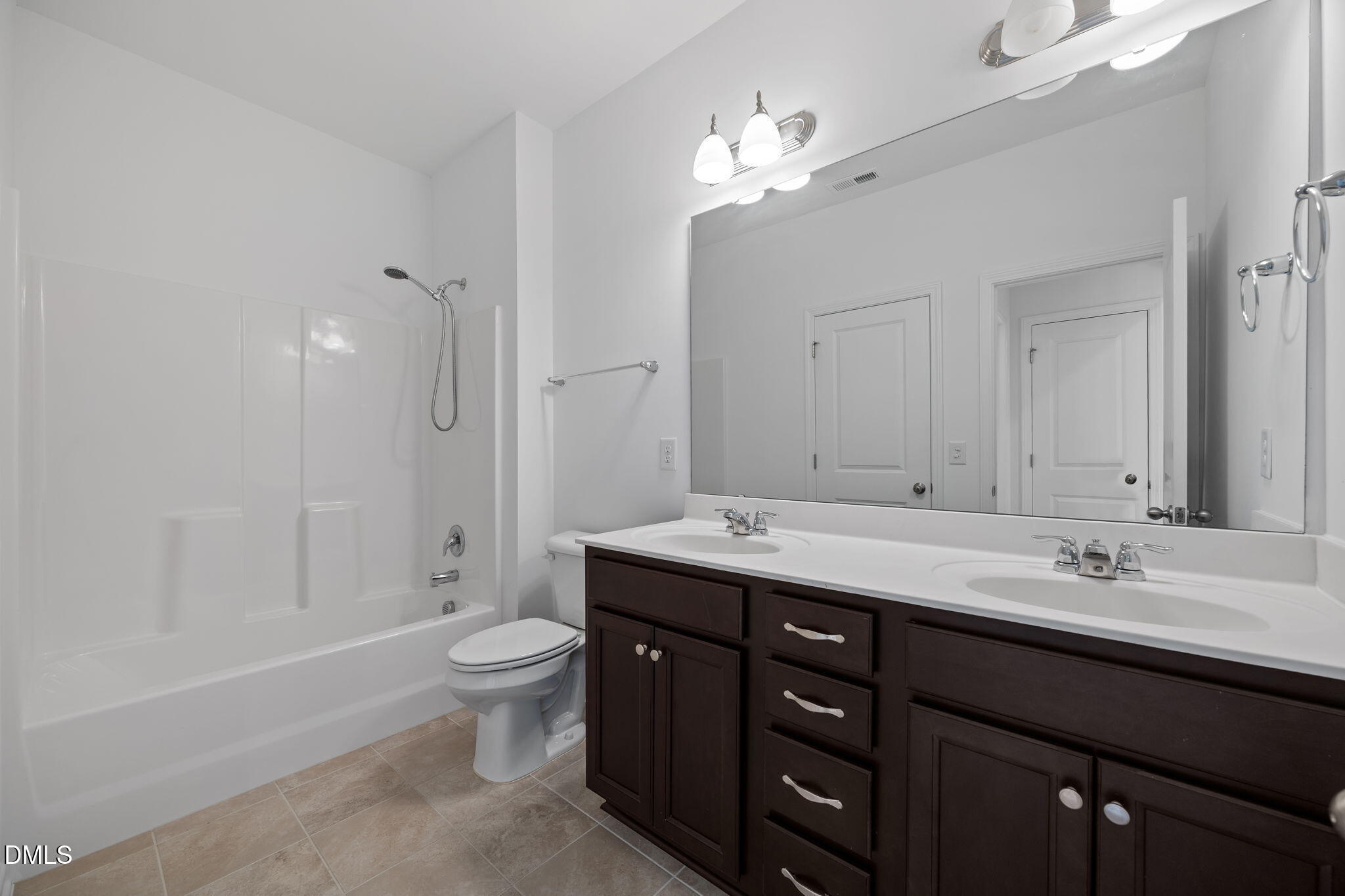 902 Talbot Place Durham, NC 27703 - Photo 36 of 49 a bathroom with a double vanity sink toilet and a mirror