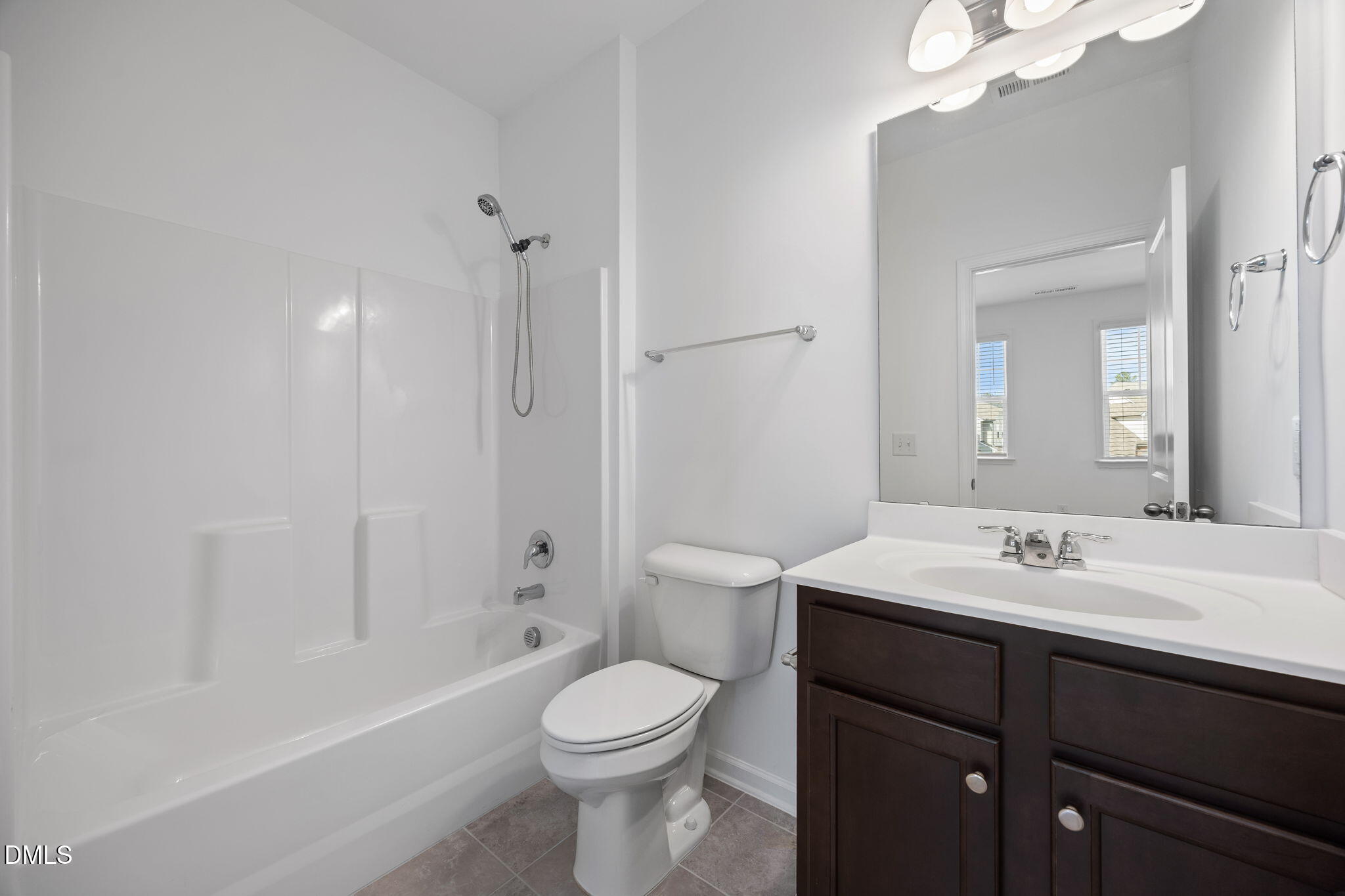 902 Talbot Place Durham, NC 27703 - Photo 41 of 49 a bathroom with a sink a toilet and shower