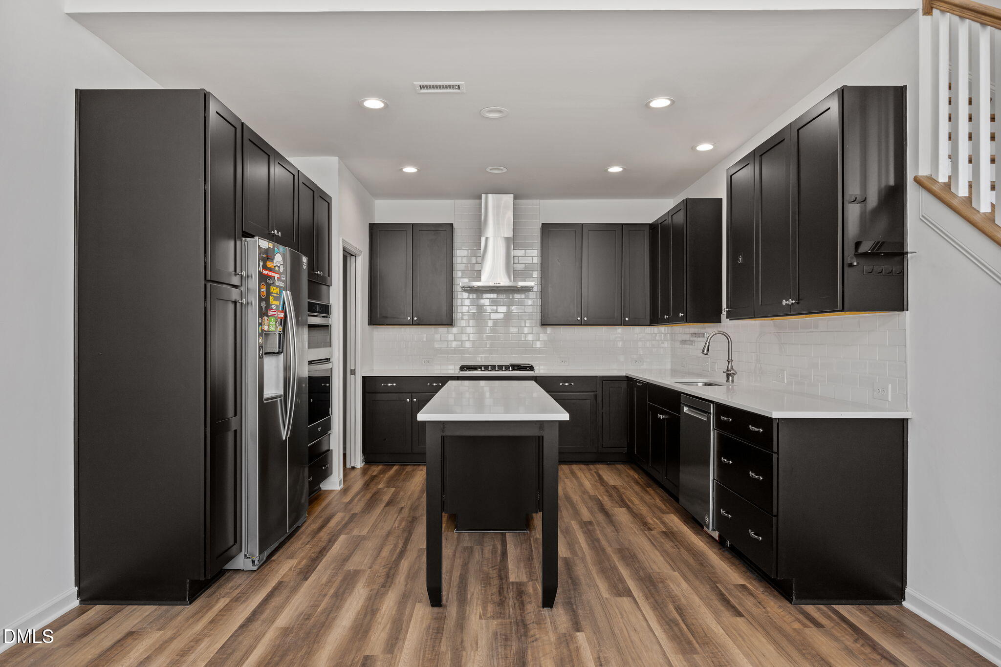 902 Talbot Place Durham, NC 27703 - Photo 8 of 49 a kitchen with kitchen island wooden cabinets and refrigerator