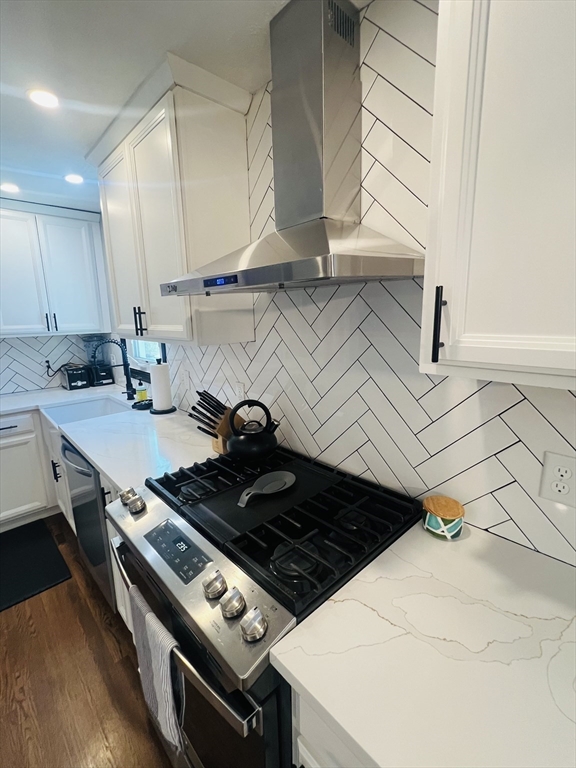 35 Pearl Street, Unit 35 Randolph, MA 02368 - Photo 12 of 31 a stove top oven sitting inside of a kitchen