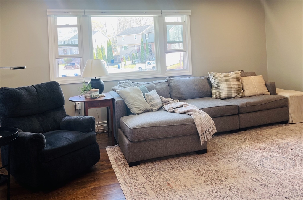 35 Pearl Street, Unit 35 Randolph, MA 02368 - Photo 13 of 31 a living room with furniture and a window